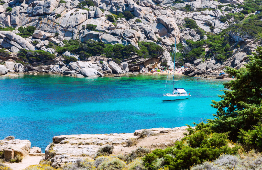 Sailboat at anchor near Capo Testa beach in Sardinia, Italy